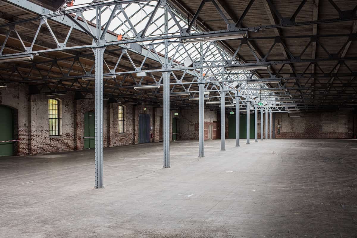 Inside of empty brick warehouse.